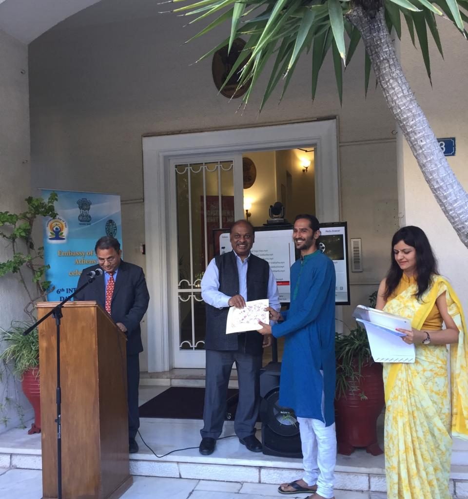 being awarded as the best yoga professional in greece by the ambassador of india to greece